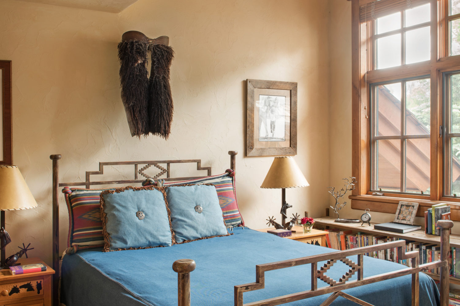 main_house_bedroom_4 A bedroom with a queen bed and a western bedframe