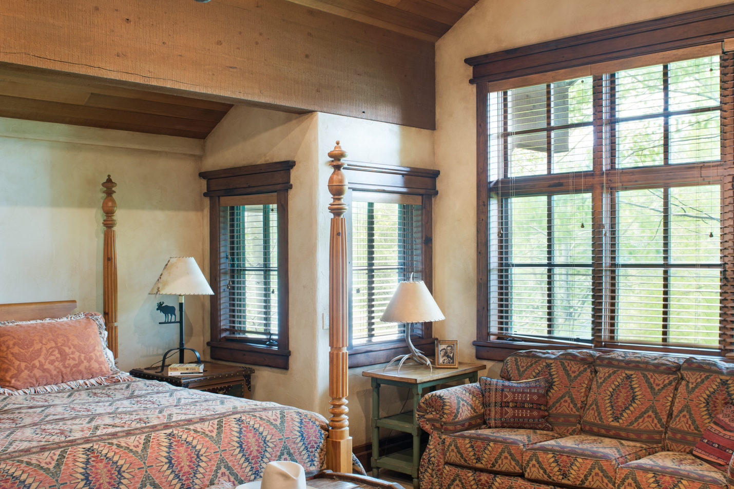 main_house_master_bedroom A large bedroom with a king-sized bed and couch