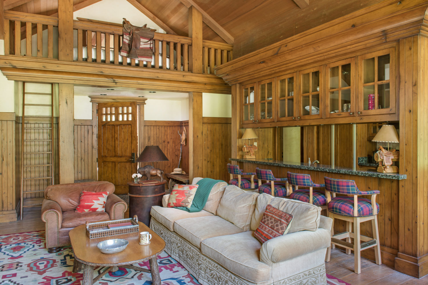 woods_house_kitchen_living_room A living room with views into a kitchen and loft area
