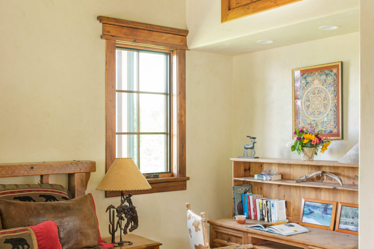 gate_house_bedroom_1 A bedroom with a queen-sized bed and desk area