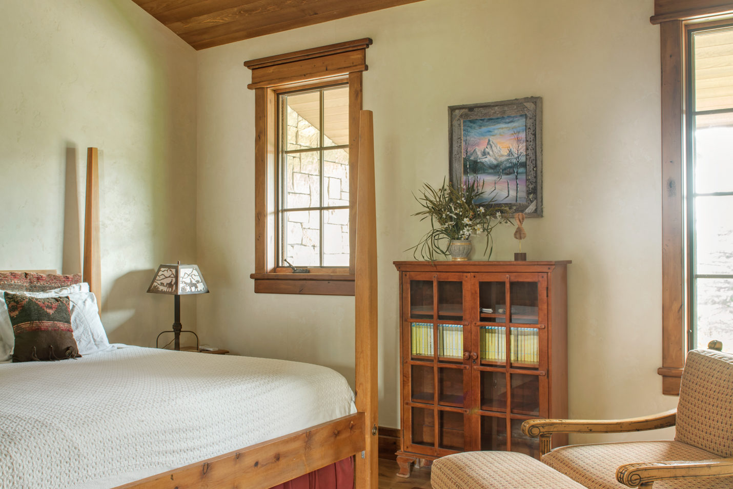 gate_house_bedroom_2 A bedroom with a king-sized bed and armchair